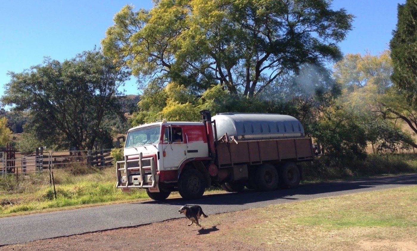 The water truck on a country road with its tank loaded